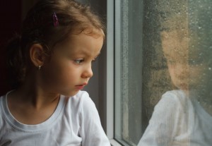 sad girl at window